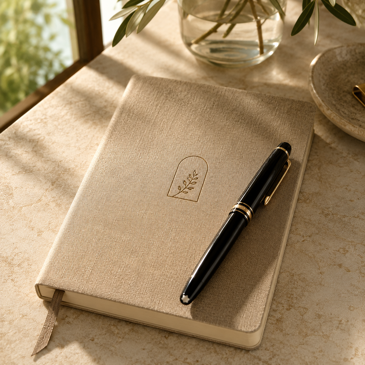 Notebook and pen on a sunlit table for Scottsdale real estate notes.